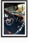 Het interieur van deze luxe auto beschikt over een strak stuur met logo in het midden, bruin lederen bekleding en een modern dashboard met diverse bedieningselementen en chromen accenten. De sfeer weerspiegelt die van een Bugatti Chiron Interior Schilderij en straalt de essentie uit van verfijnde luxe wanddecoratie van CollageDepot.