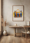 Een minimalistisch interieur met een houten bureau tegen een beige muur. Boven het bureau hangt een Louis Vuitton Oranje Handtas Schilderij van CollageDepot met blauwe, gele en oranje accenten. Bij het bureau staat een houten stoel en vlakbij staat een vaas met gedroogd pampagras.,Lichtbruin